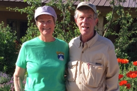 Dick and Gay Sise Grossman ’65 standing in front of flowers